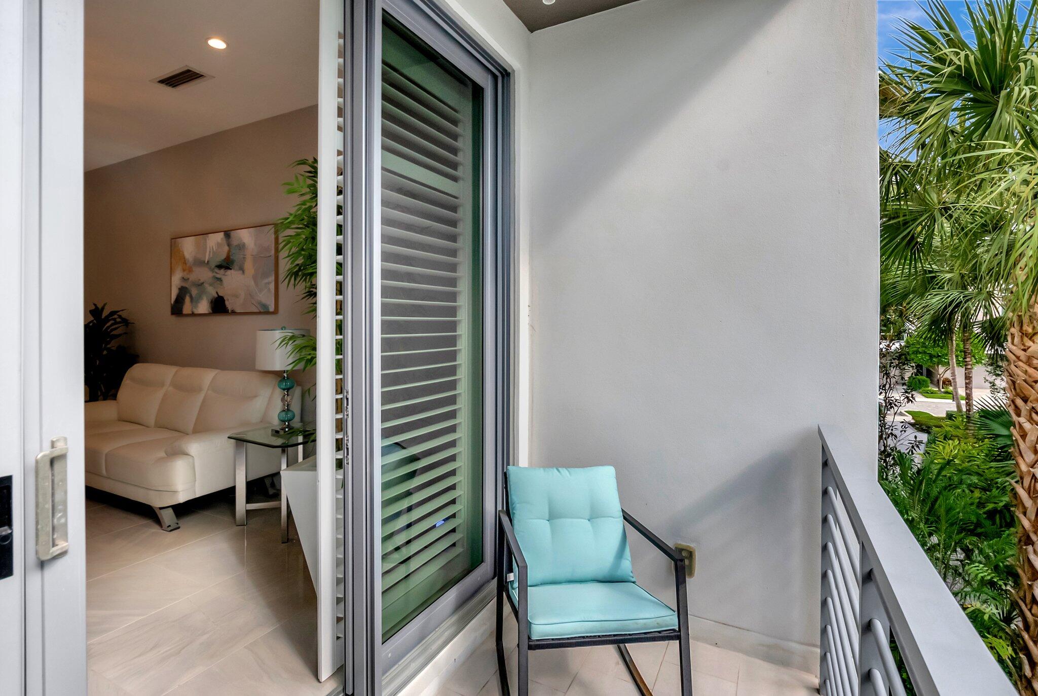 4010 Northwest 18th Way Boca Raton, FL 33431 - Photo 14 of 35 a balcony with furniture and a potted plant