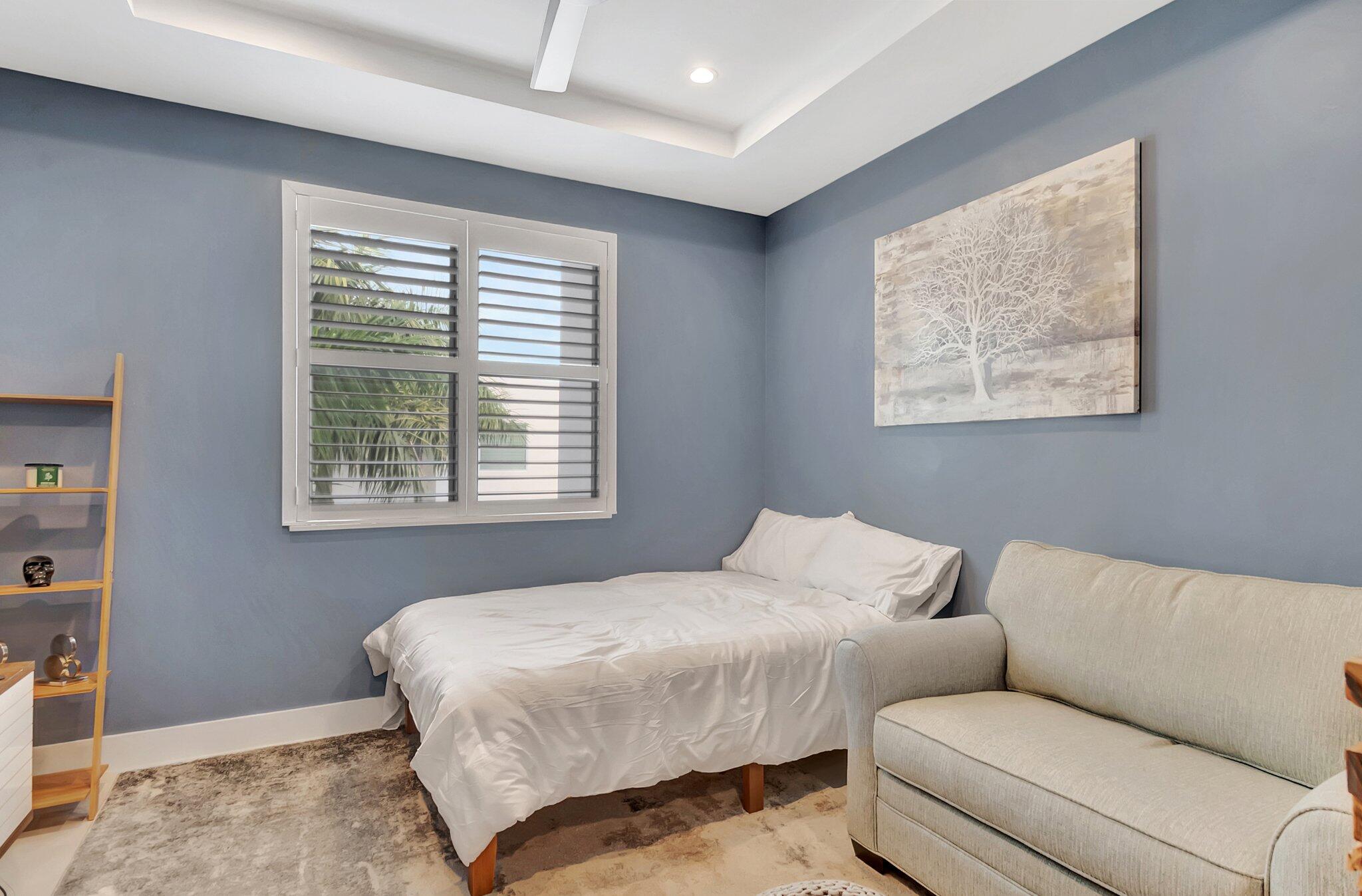 4010 Northwest 18th Way Boca Raton, FL 33431 - Photo 20 of 35 a bedroom with furniture and a window