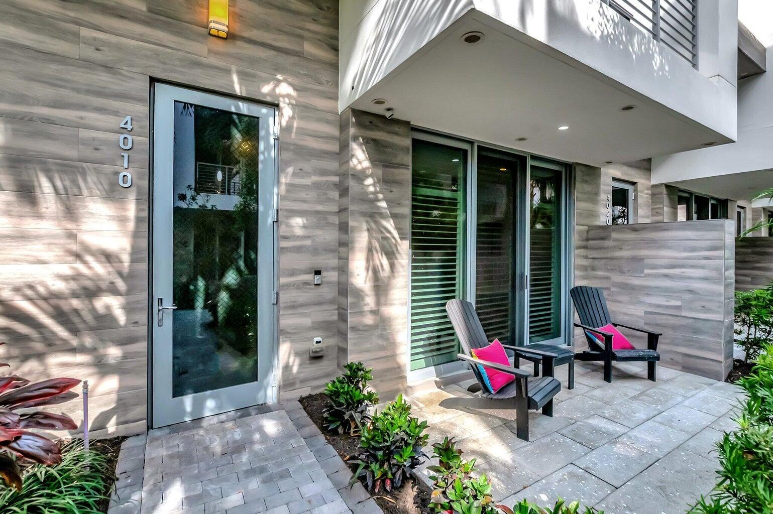 4010 Northwest 18th Way Boca Raton, FL 33431 - Photo 2 of 35 a backyard of a house with outdoor seating