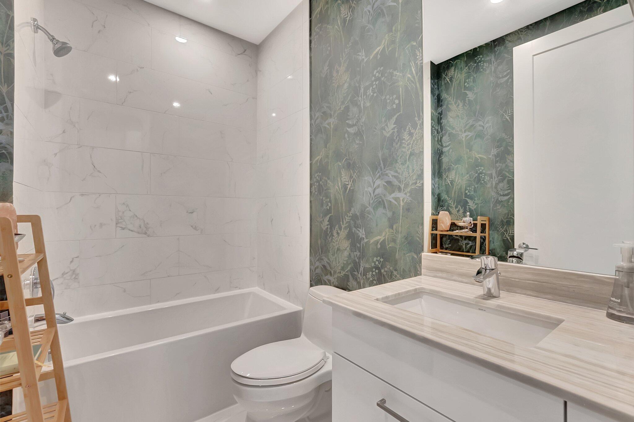 4010 Northwest 18th Way Boca Raton, FL 33431 - Photo 22 of 35 a bathroom with a granite countertop sink a toilet and shower