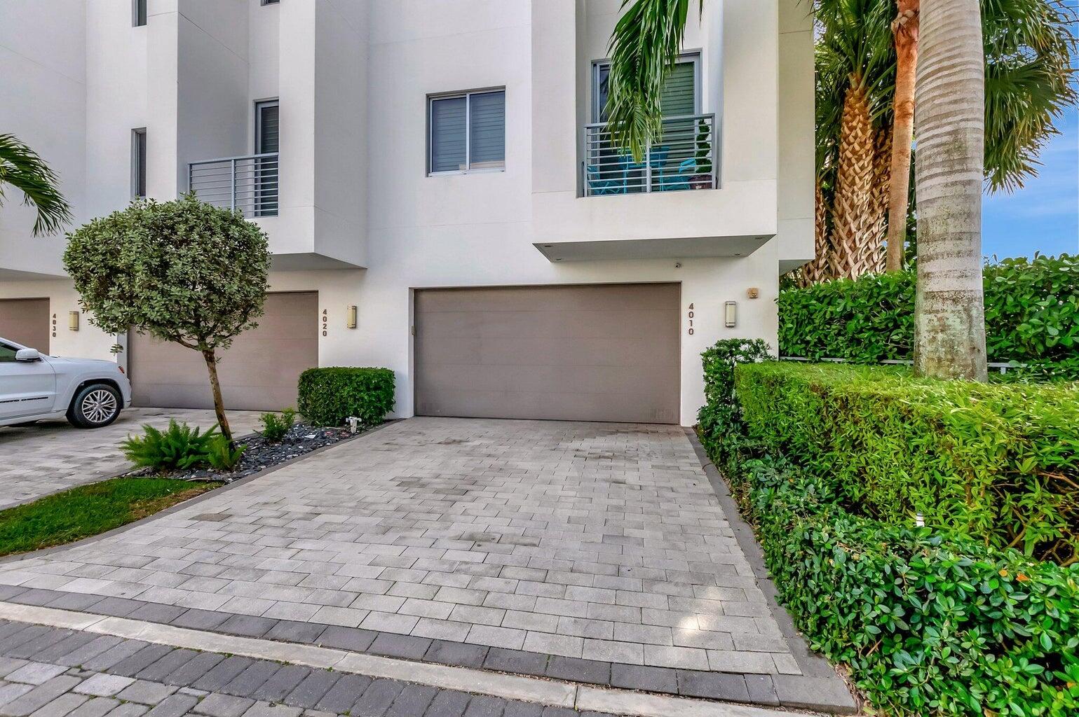 4010 Northwest 18th Way Boca Raton, FL 33431 - Photo 31 of 35 a front view of a house with garden