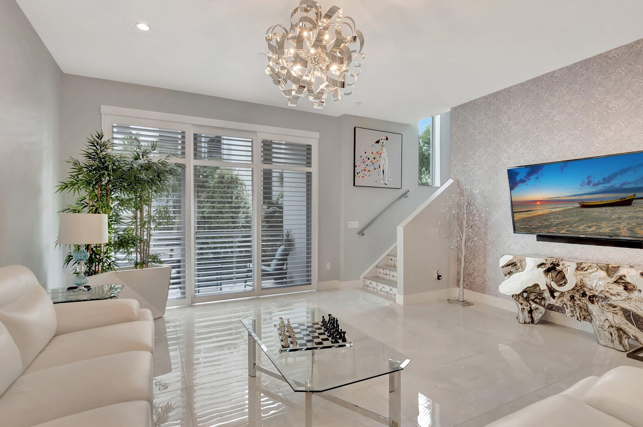 4010 Northwest 18th Way Boca Raton, FL 33431 - Photo 4 of 35 a living room with furniture and a flat screen tv