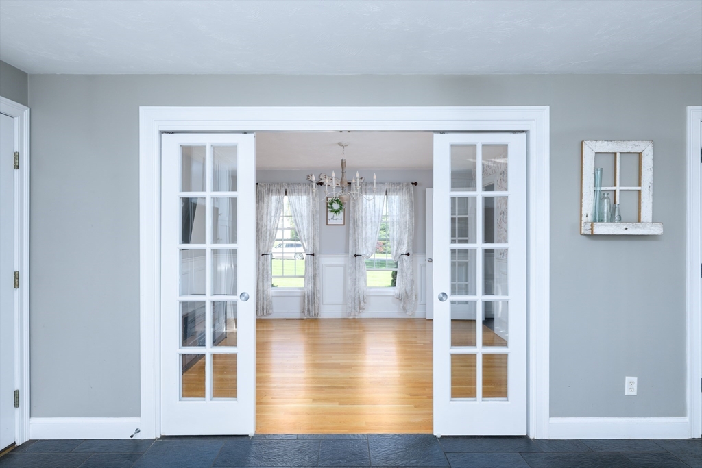27 Vista Circle Rutland, MA 01543 - Photo 11 of 35 a view of wooden floor and windows in a room