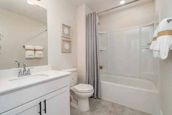a bathroom with a toilet a sink and a bathtub