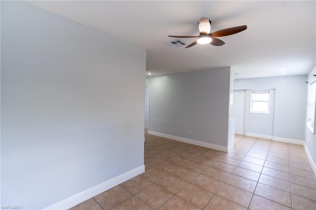 1940 48th Street Southwest Naples, FL 34116 - Photo 19 of 33 Tiled flooring extends throughout this interior space featuring a ceiling fan with integrated lighting, recessed lighting, and white baseboards