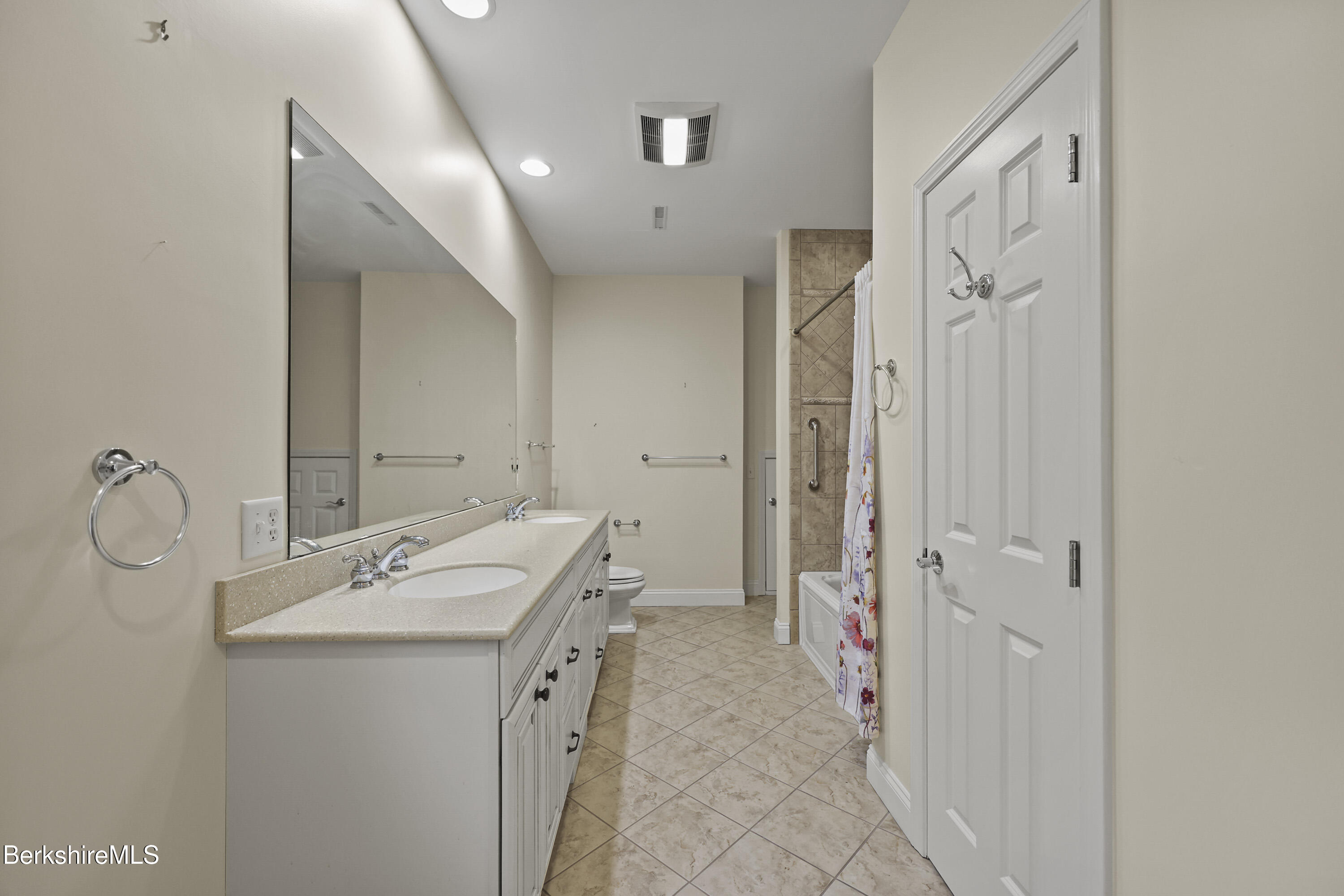 2 Amy Court Pittsfield, MA 01201 - Photo 38 of 50 a bathroom with a sink a mirror and a shower