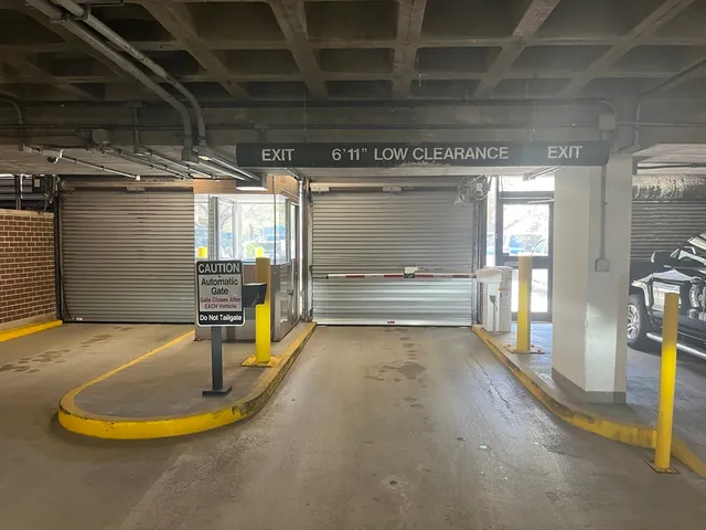 a view of water heater room with wooden floor