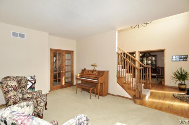 389 Winter Springs Road Nazareth, PA 18064 - Photo 12 of 37 a living room with furniture and a flat screen tv