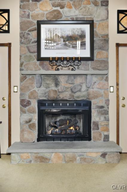 389 Winter Springs Road Nazareth, PA 18064 - Photo 16 of 37 a fireplace with a clock on top