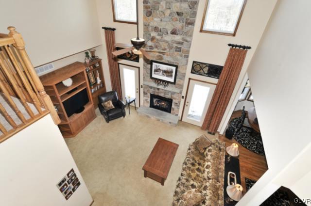 389 Winter Springs Road Nazareth, PA 18064 - Photo 20 of 37 a living room with furniture and a fireplace