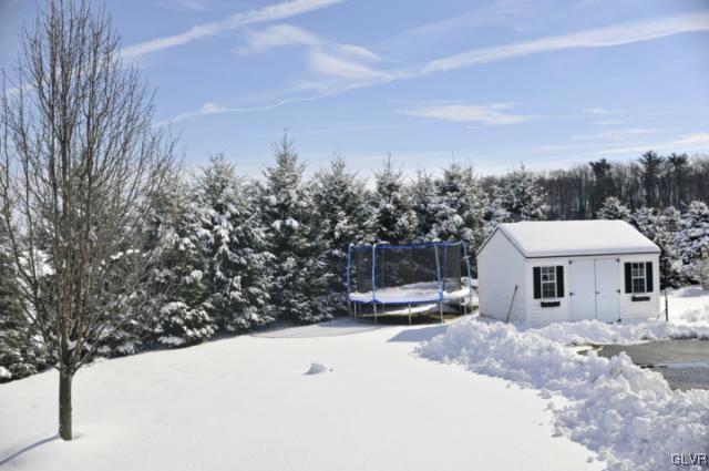 389 Winter Springs Road Nazareth, PA 18064 - Photo 36 of 37 a view of a house with a yard covered in snow