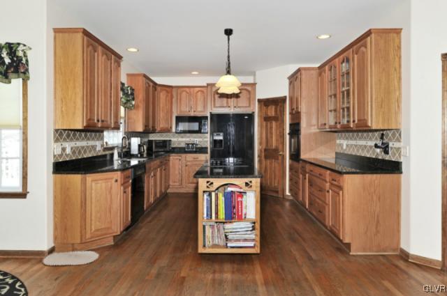 389 Winter Springs Road Nazareth, PA 18064 - Photo 4 of 37 a kitchen with stainless steel appliances granite countertop a refrigerator a stove top oven and a sink