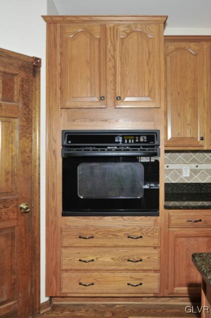 389 Winter Springs Road Nazareth, PA 18064 - Photo 8 of 37 a stove top oven sitting inside of a kitchen