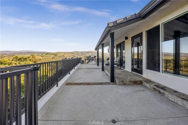 a view of balcony with furniture