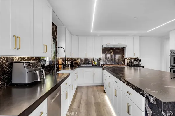 a bedroom with furniture and a flat screen tv