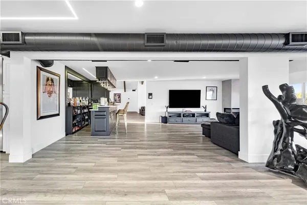 a kitchen with stainless steel appliances a refrigerator a sink and a stove