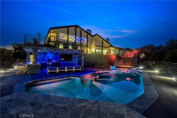 a view of a house with a swimming pool