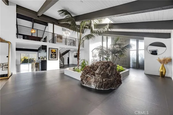 a room with lots of wooden furniture and lots of wooden furniture