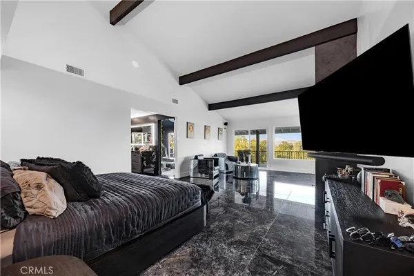 a living room with lots of furniture and a flat screen tv