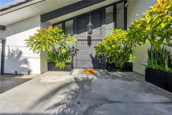 a backyard of a house with outdoor seating