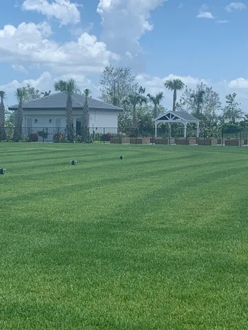 a view of a patio with dining table and chairs