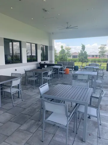 a view of a brick house with a large window