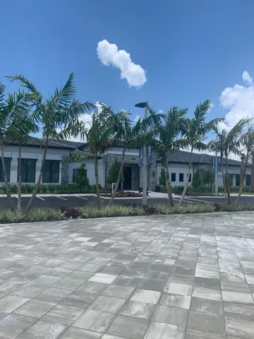 a view of a swimming pool with an outdoor seating