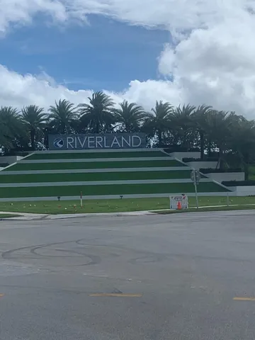 a view of a golf course with a big yard