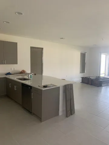 a view of a living room hardwood and kitchen