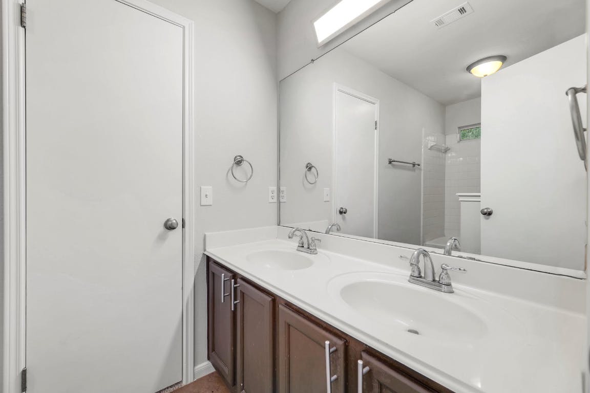 214 Crystal Knoll Boulevard Georgetown, TX 78626 - Photo 12 of 21 a bathroom with a sink and a mirror