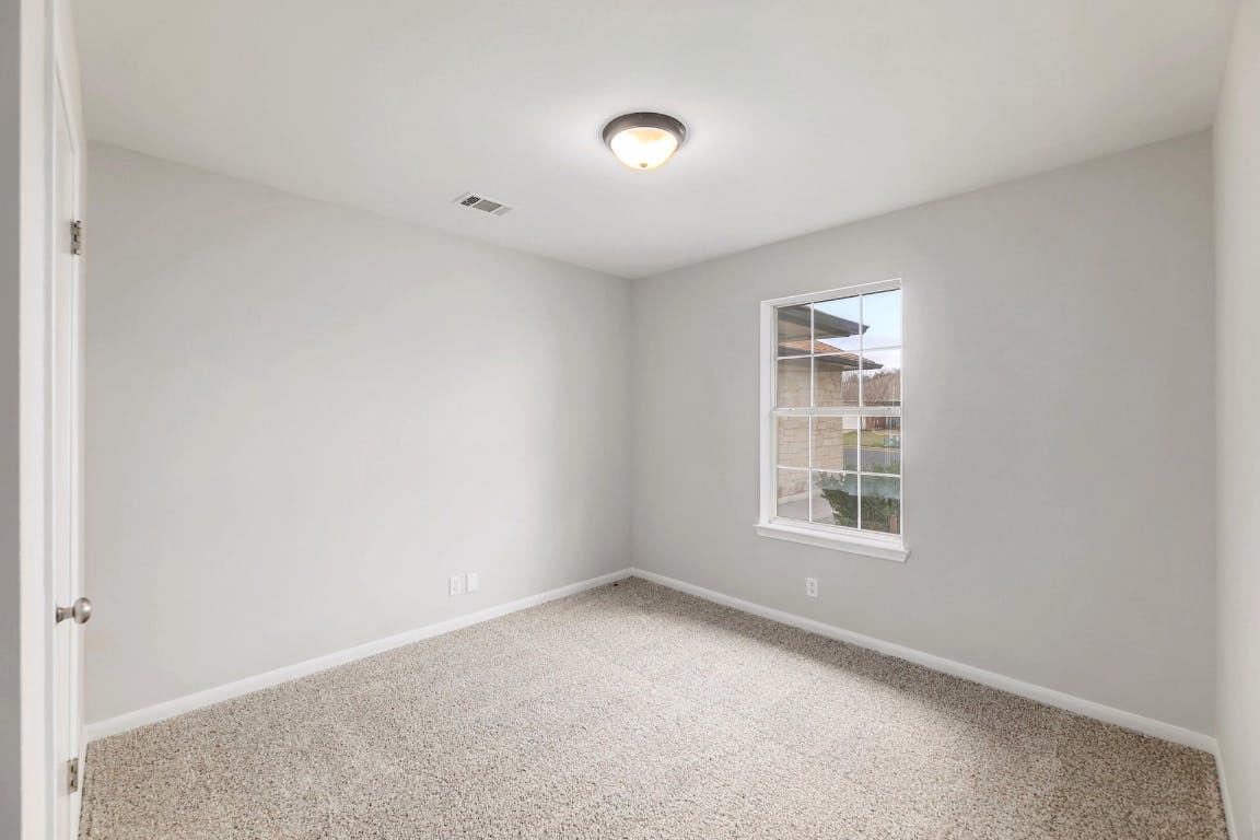 214 Crystal Knoll Boulevard Georgetown, TX 78626 - Photo 15 of 21 an empty room with windows