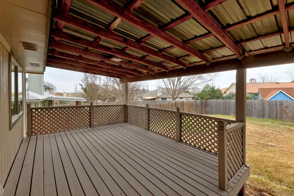 a front view of house with yard and trees