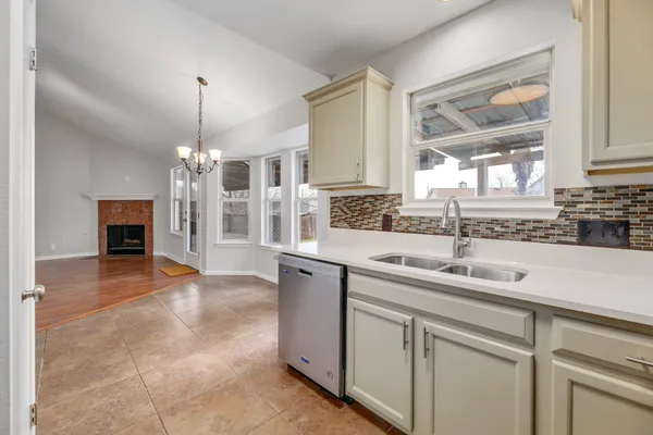 a view of a kitchen with a sink cabinets and window