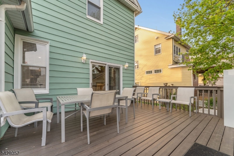 119 Edgewood Road Linden, NJ 07036 - Photo 12 of 31 a view of a wooden chairs and table on the wooden deck