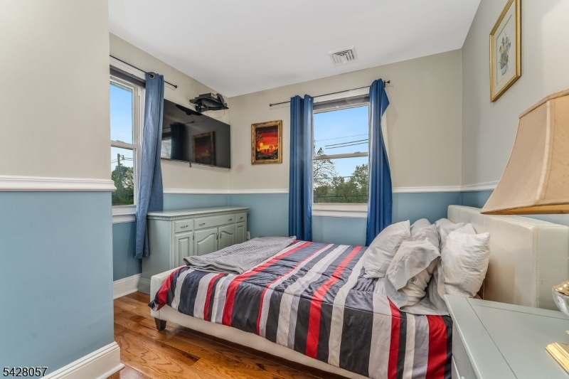 119 Edgewood Road Linden, NJ 07036 - Photo 14 of 31 a bedroom with a bed and dresser