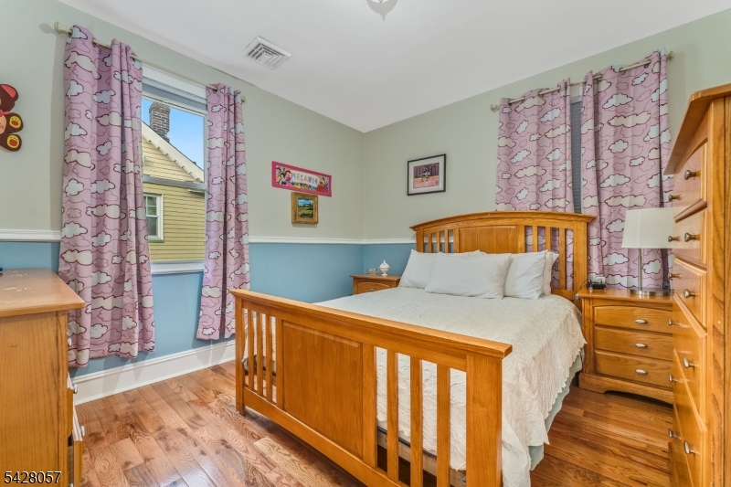 119 Edgewood Road Linden, NJ 07036 - Photo 15 of 31 a bedroom with a bed and a painting on the wall