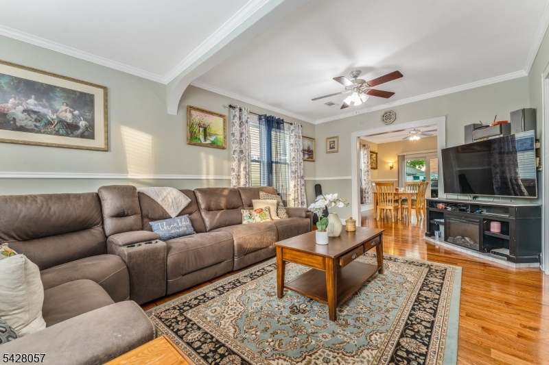 119 Edgewood Road Linden, NJ 07036 - Photo 5 of 31 a living room with furniture and a flat screen tv