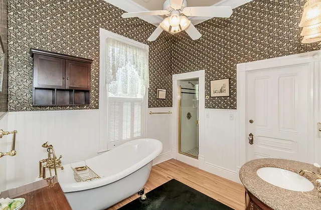 a bathroom with a sink mirror and vanity