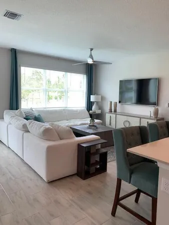 a living room with furniture and a flat screen tv