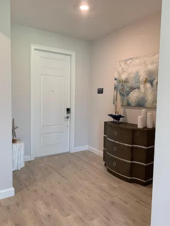 a room with a bed and a mirror