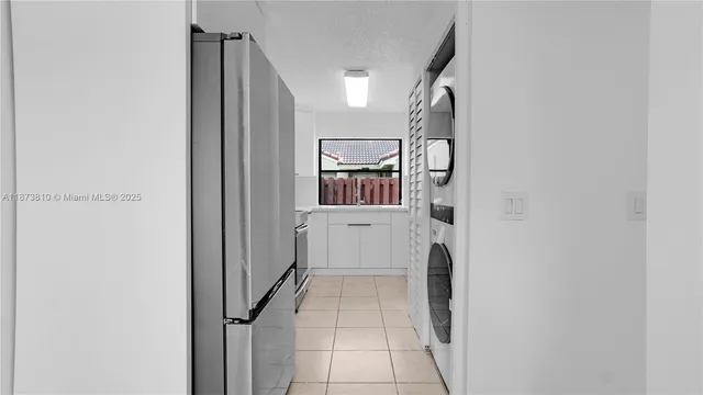 a view of a kitchen with washer and dryer