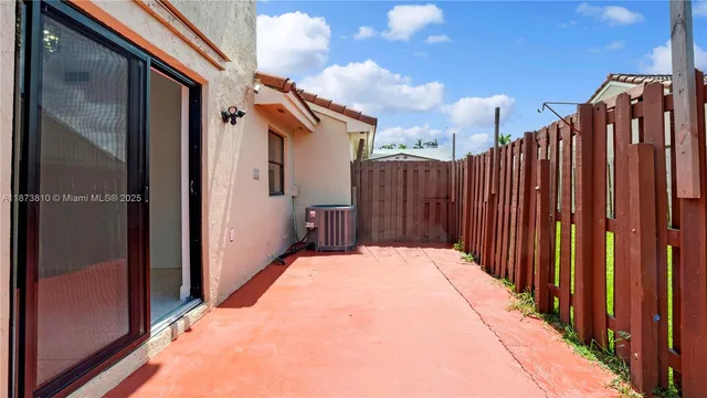 an aerial view of multiple houses with yard