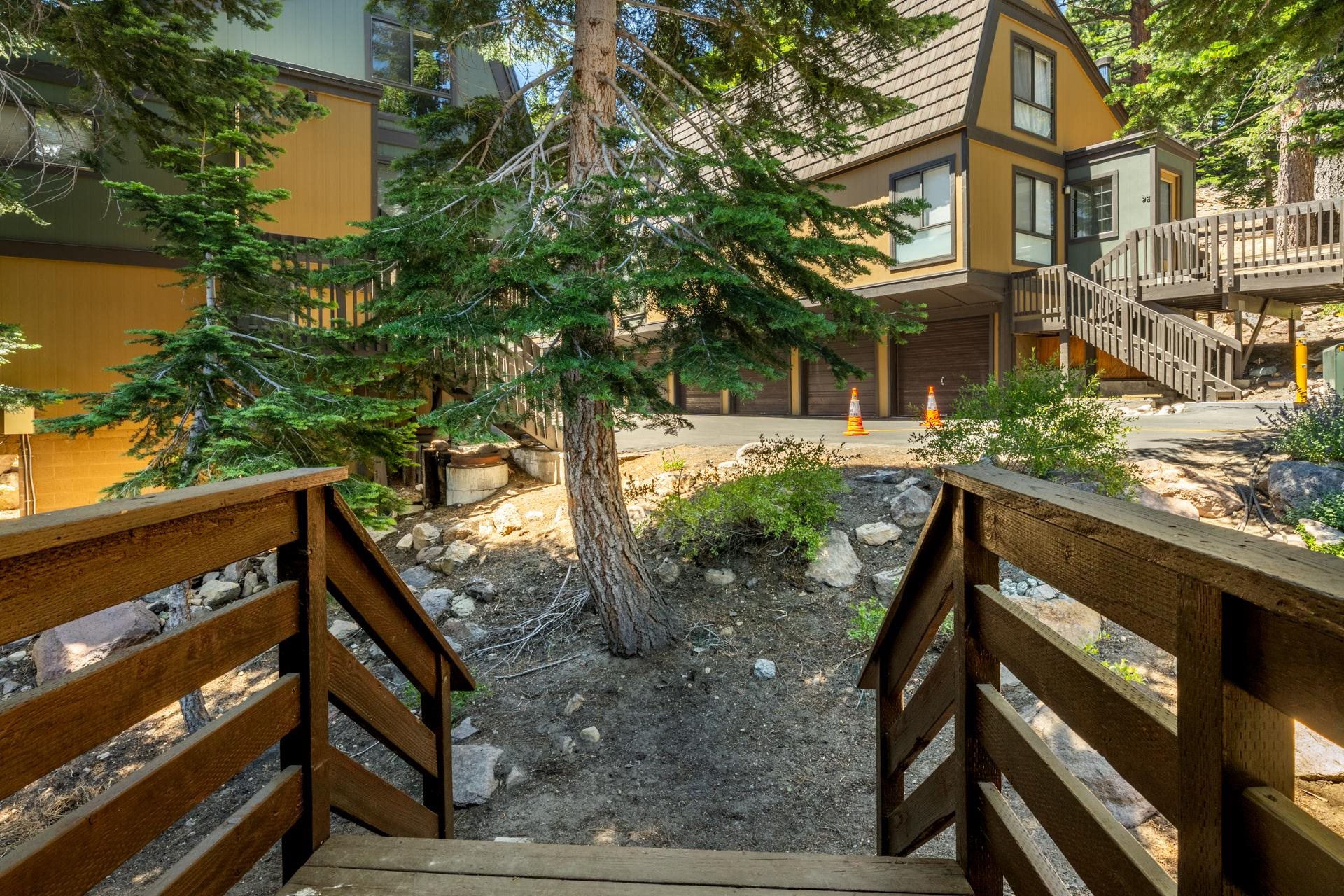 50 Hidden Valley Road, Unit 17 Mammoth Lakes, CA 93546 - Photo 20 of 40 Multi-level property featuring a prominent A-frame architectural element and a natural rock landscap