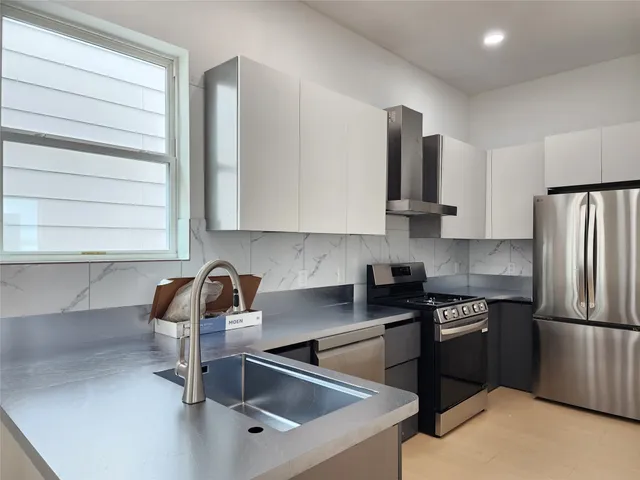 a bathroom with a sink a toilet and bathtub