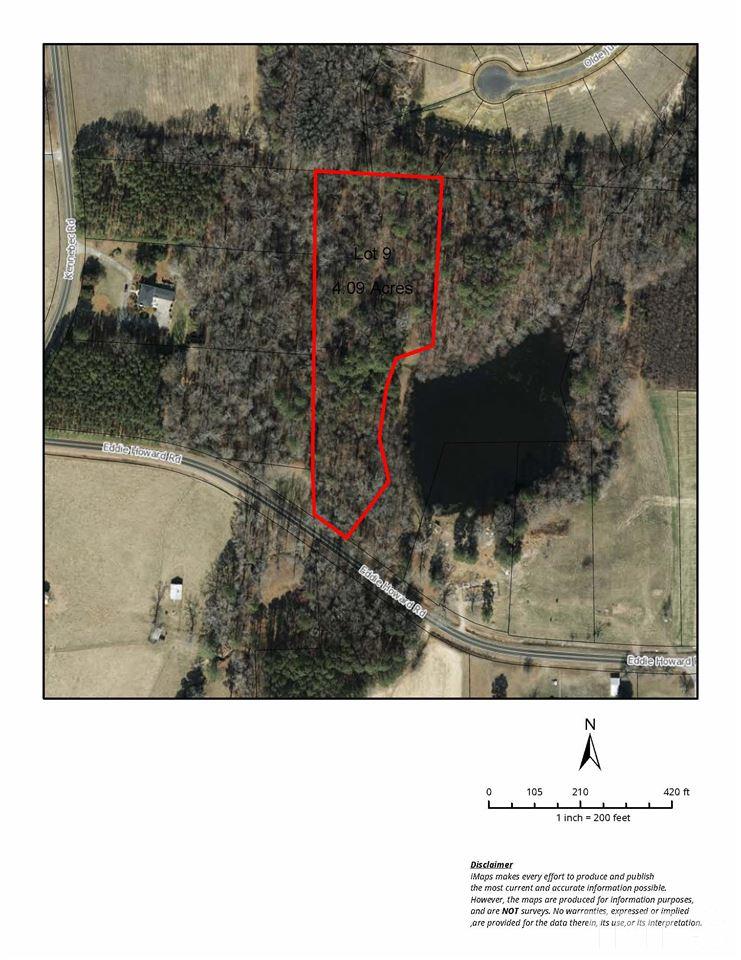 1911 Eddie Howard Road Willow Spring, NC 27592 - Photo 1 of 12 a black and white photo of a lake