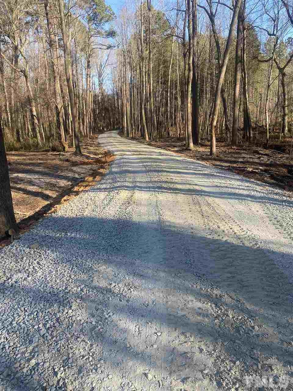 1911 Eddie Howard Road Willow Spring, NC 27592 - Photo 2 of 12 a view of yard with trees