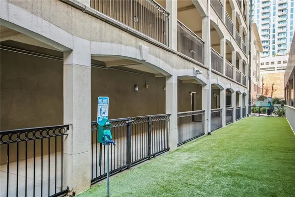 a view of a building with a small yard