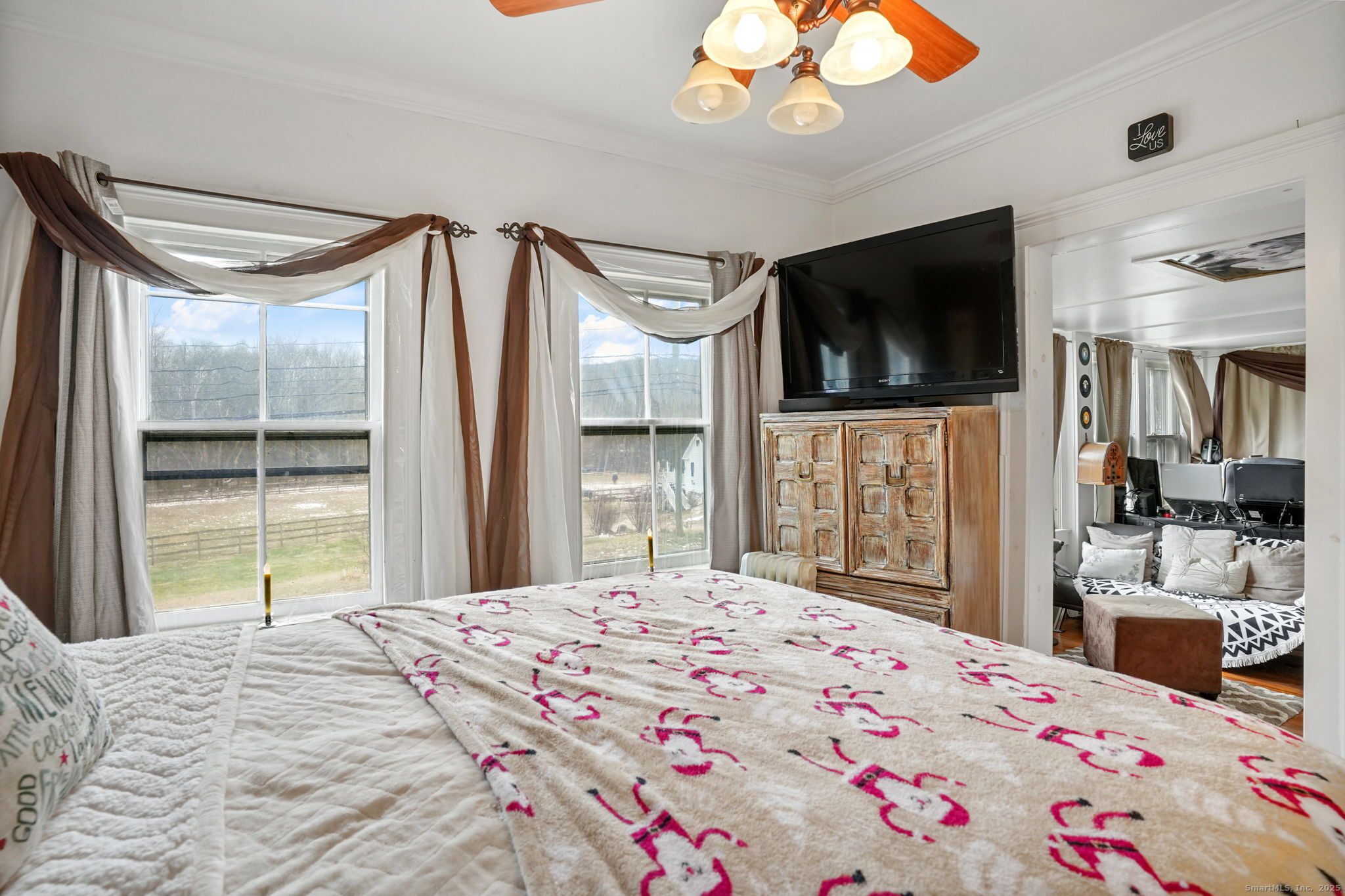 216 Baker Road Roxbury, CT 06783 - Photo 18 of 33 a bedroom with a bed and a flat screen tv