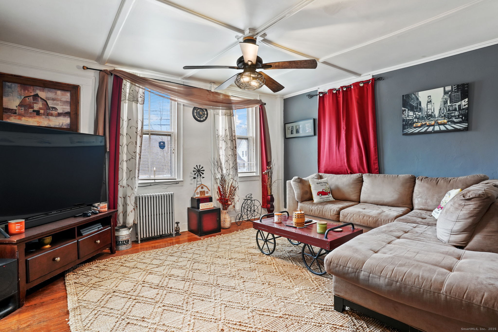 216 Baker Road Roxbury, CT 06783 - Photo 4 of 33 a living room with furniture a flat screen tv and a chandelier