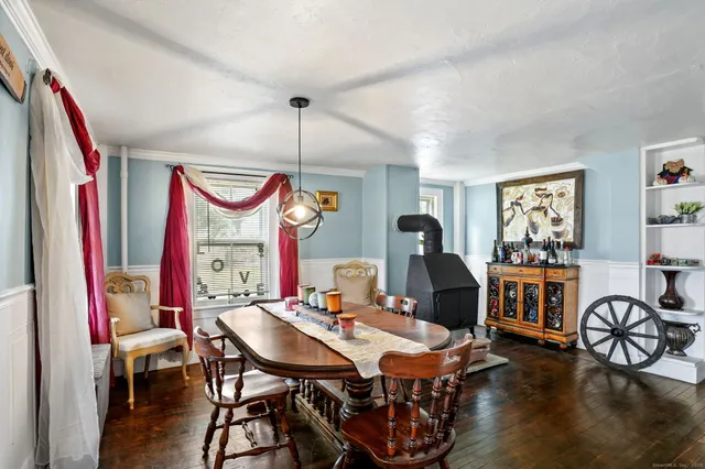a view of a dining room with furniture window and wooden floor
